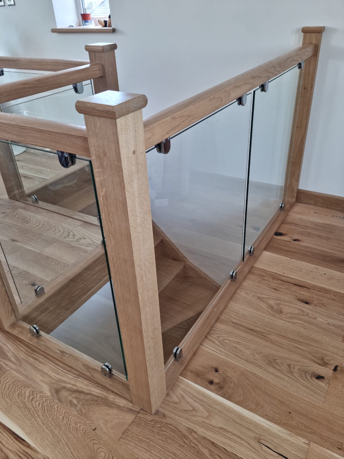 Completed loft interior with timber flooring and bespoke staircase joinery